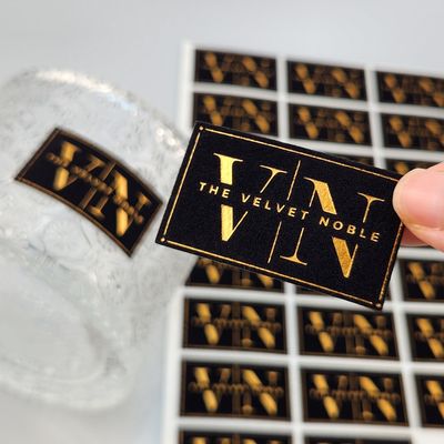 Harga yang bagus Kartu Cetak Emas UV Emboss Kustom Kualitas Tinggi Kertas Seni Emas Foil Stiker Label Stempel Emas Beludru untuk Parfum & Pesta on line